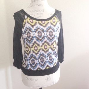 blue and yellow geometric knit top